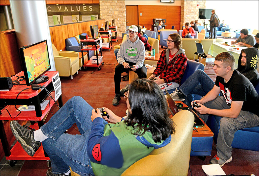 Students playing video games in the FLCC lounge
