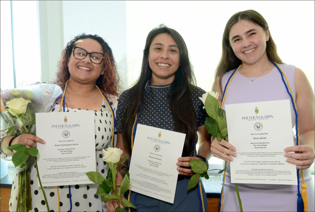 3 women holding PTK certificates